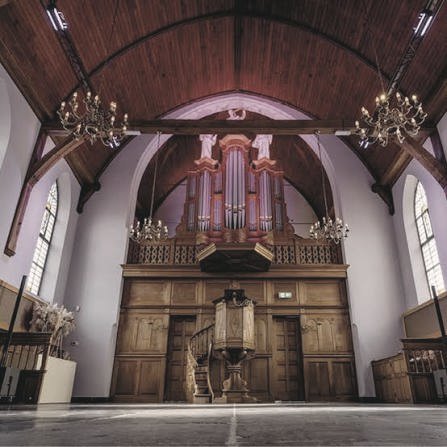 Inside the church: timber ceiling, chandeliers and the old organ